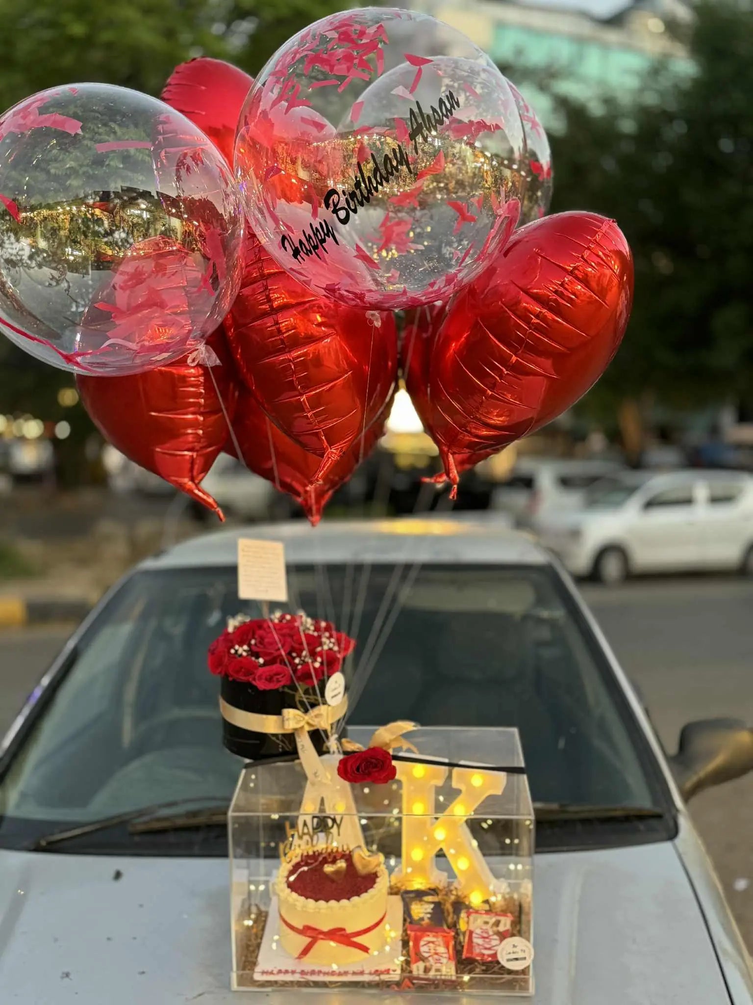 Anniversary gift acrylic box with cake, flowers, LED letter, chocolates and balloons – florist in Islamabad