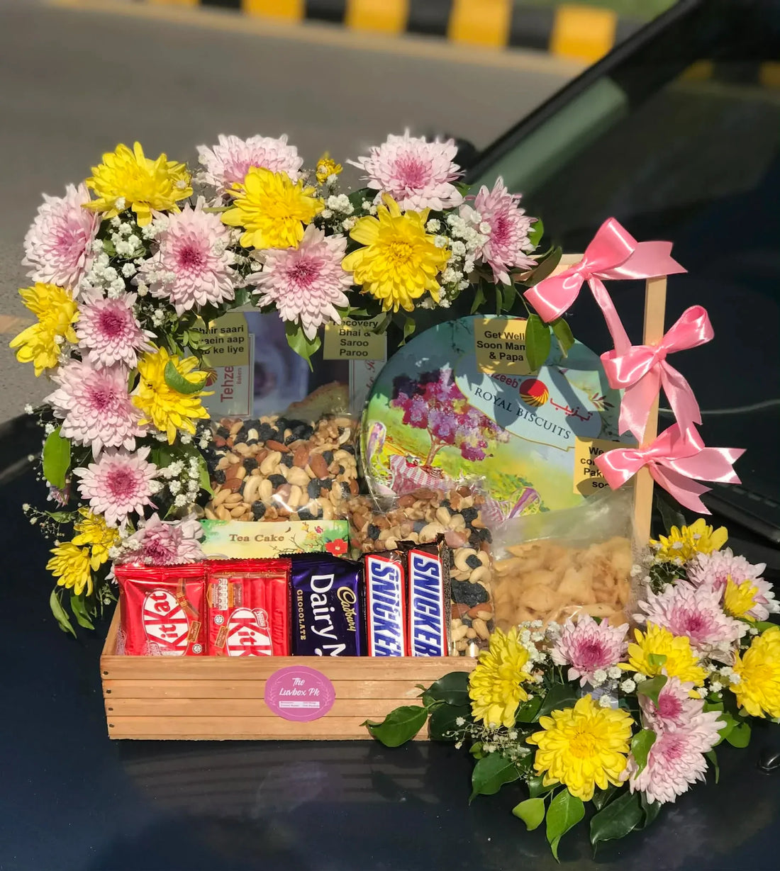 Gifts for parents in Pakistan from abroad flowers cake and gift hamper
