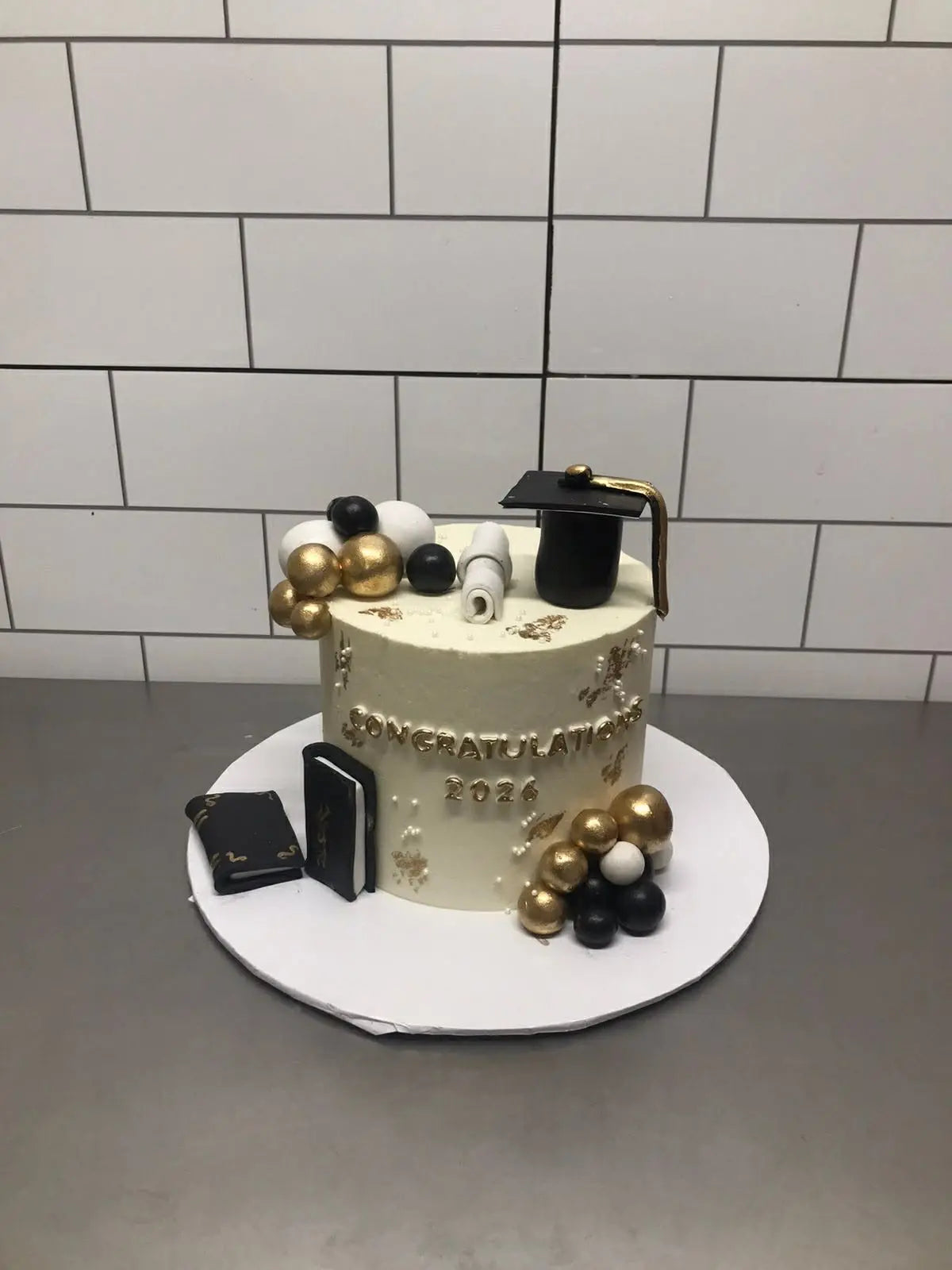 3 lbs premium graduation cake in white gold and black theme from giftshop Islamabad
