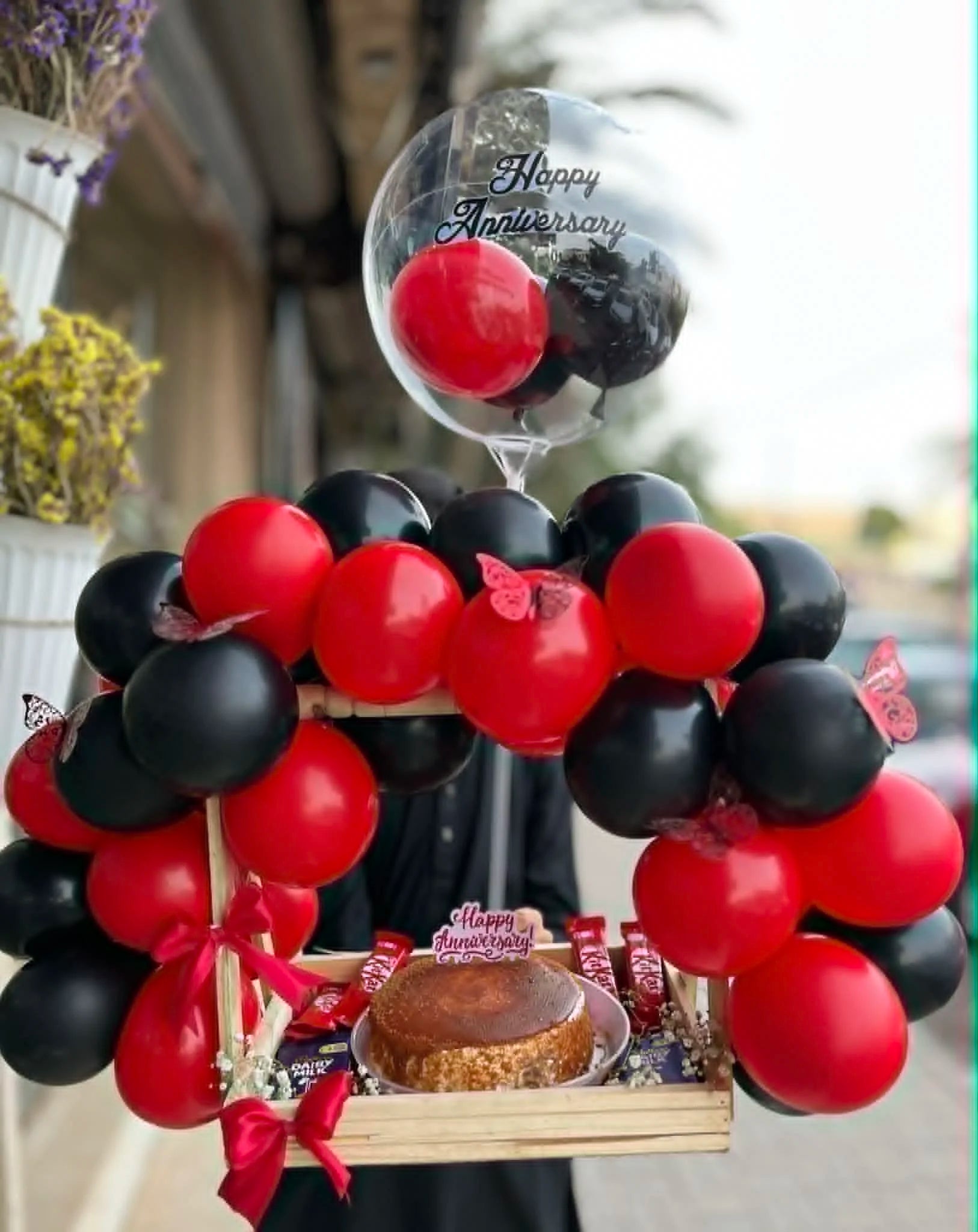 Anniversary wooden basket with balloon arch cake and chocolates luxury gift delivery Pakistan