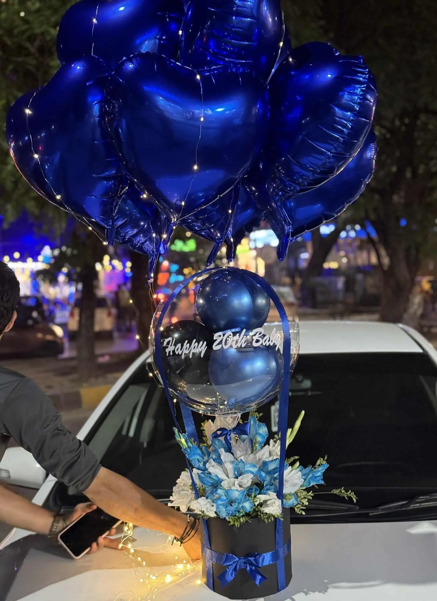 Balloon surprise box for him with white and blue flowers, foil balloons and LED lights – perfect gift in Pakistan
