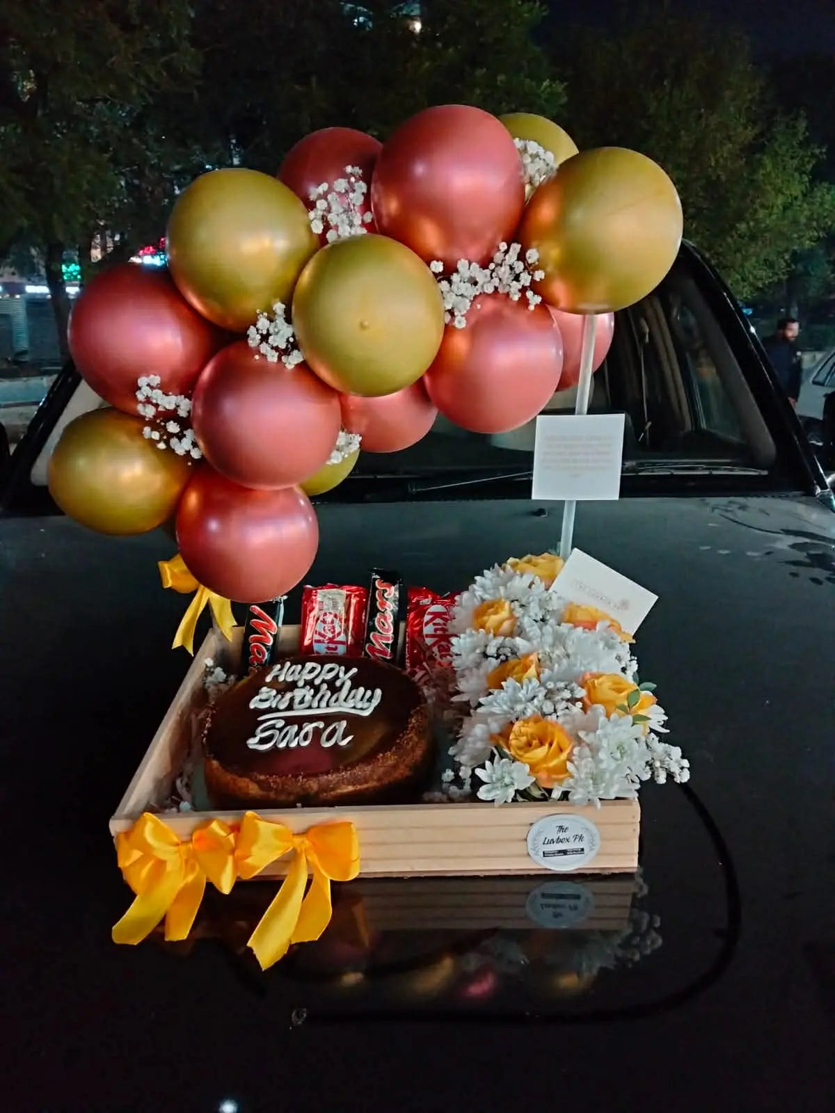 Birthday combo tray with cake, balloons, fresh flowers and chocolates for gift delivery in Islamabad.