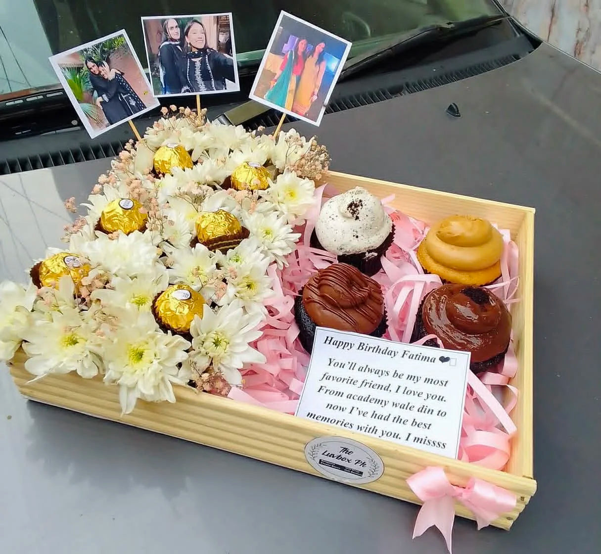 Birthday wooden tray with flowers, Ferrero chocolates and cupcakes for gifting in Islamabad.