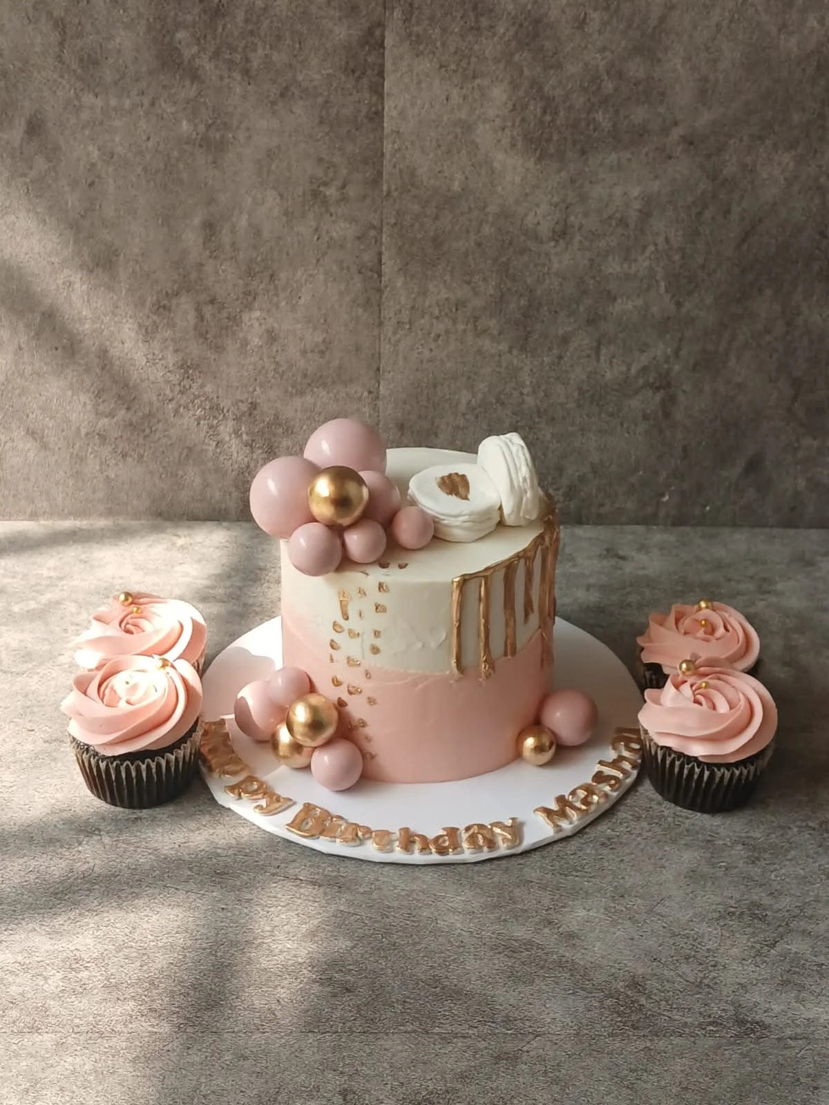 Beautiful 3 lbs pink and white customized birthday cake with four matching cupcakes, online cake delivery Islamabad and Pakistan