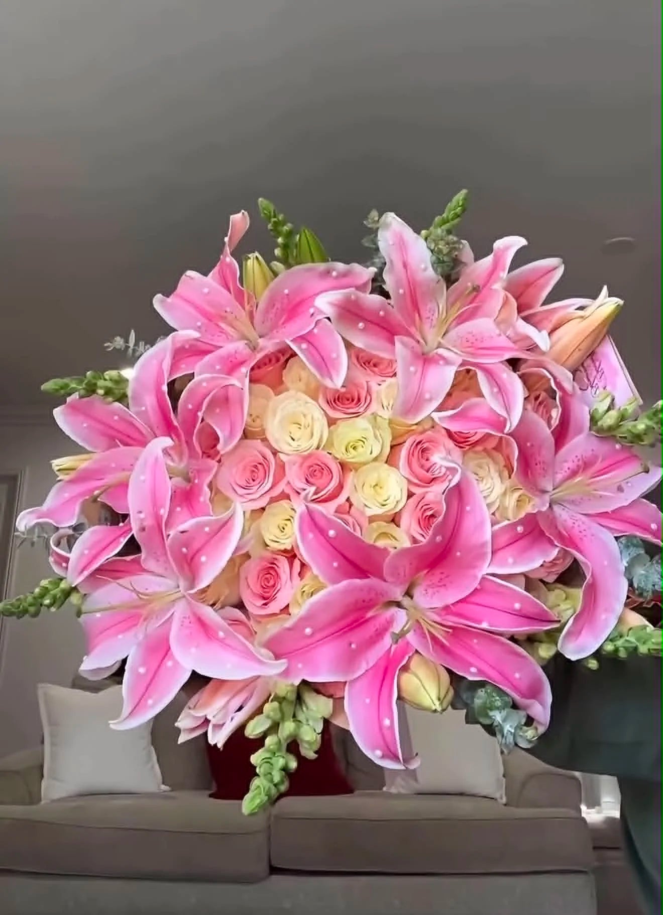 Luxury oversized bouquet of pink and white roses with elegant lilies arranged on top, beautifully wrapped for flower delivery in Islamabad.