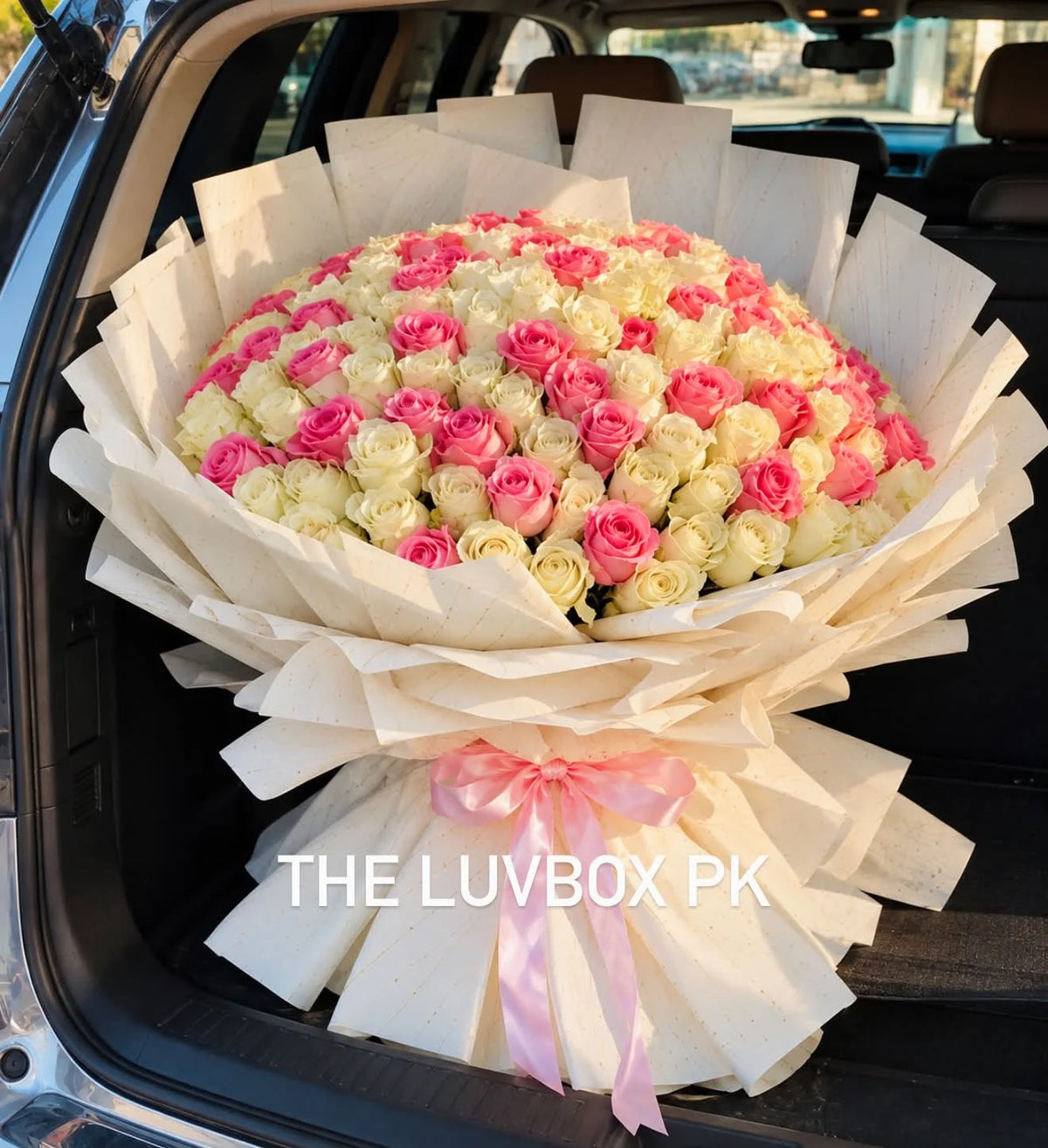 Oversized luxury bouquet of 100 premium imported pink and white flowers for her with flower delivery in Islamabad and Pakistan