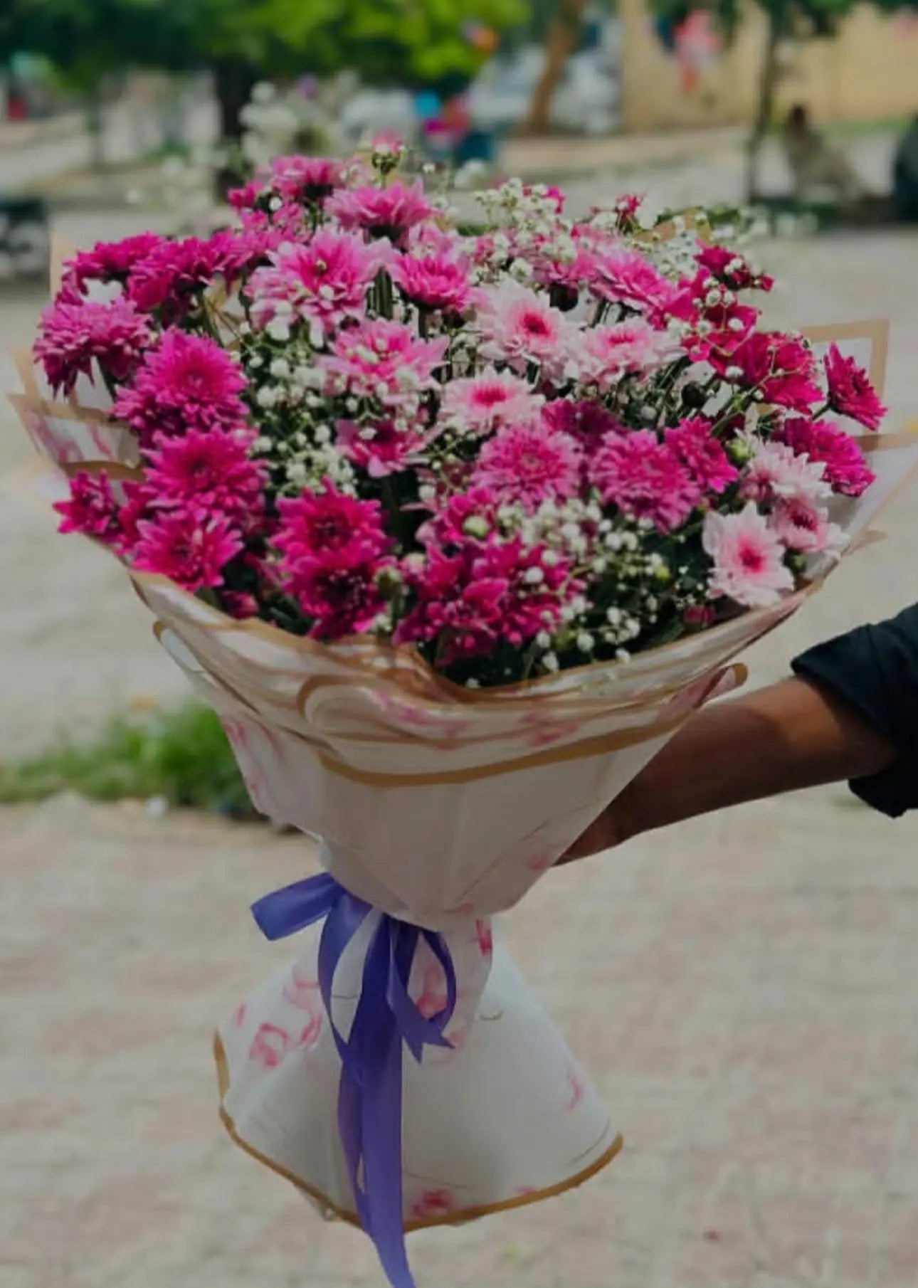 Pink and maroon chrysanthemum bouquet with babys breath from gift shop Islamabad
