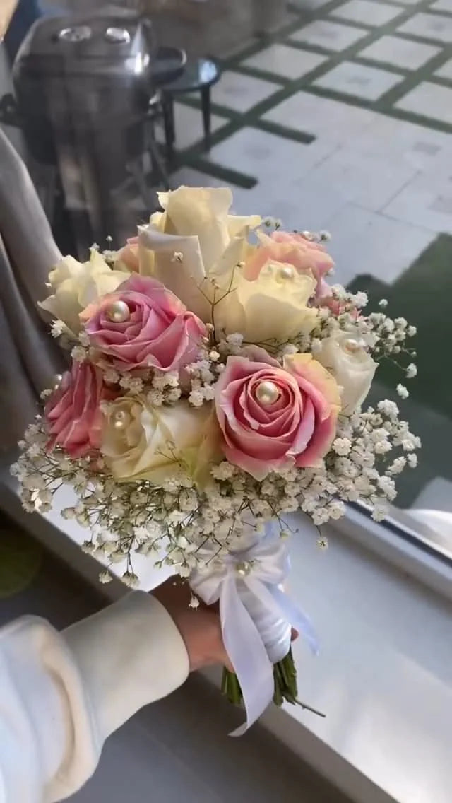 Cute bridal hand tied bouquet with pink and white roses, elegant wedding flowers for brides, Nikah ceremonies, and bridal events in Pakistan.