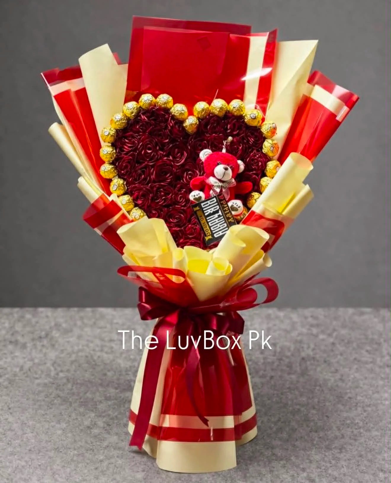 Heart-shaped rose and Ferrero Rocher chocolate bouquet wrapped like a luxury flower bouquet, perfect for romantic gifts, anniversaries and birthdays in Islamabad.