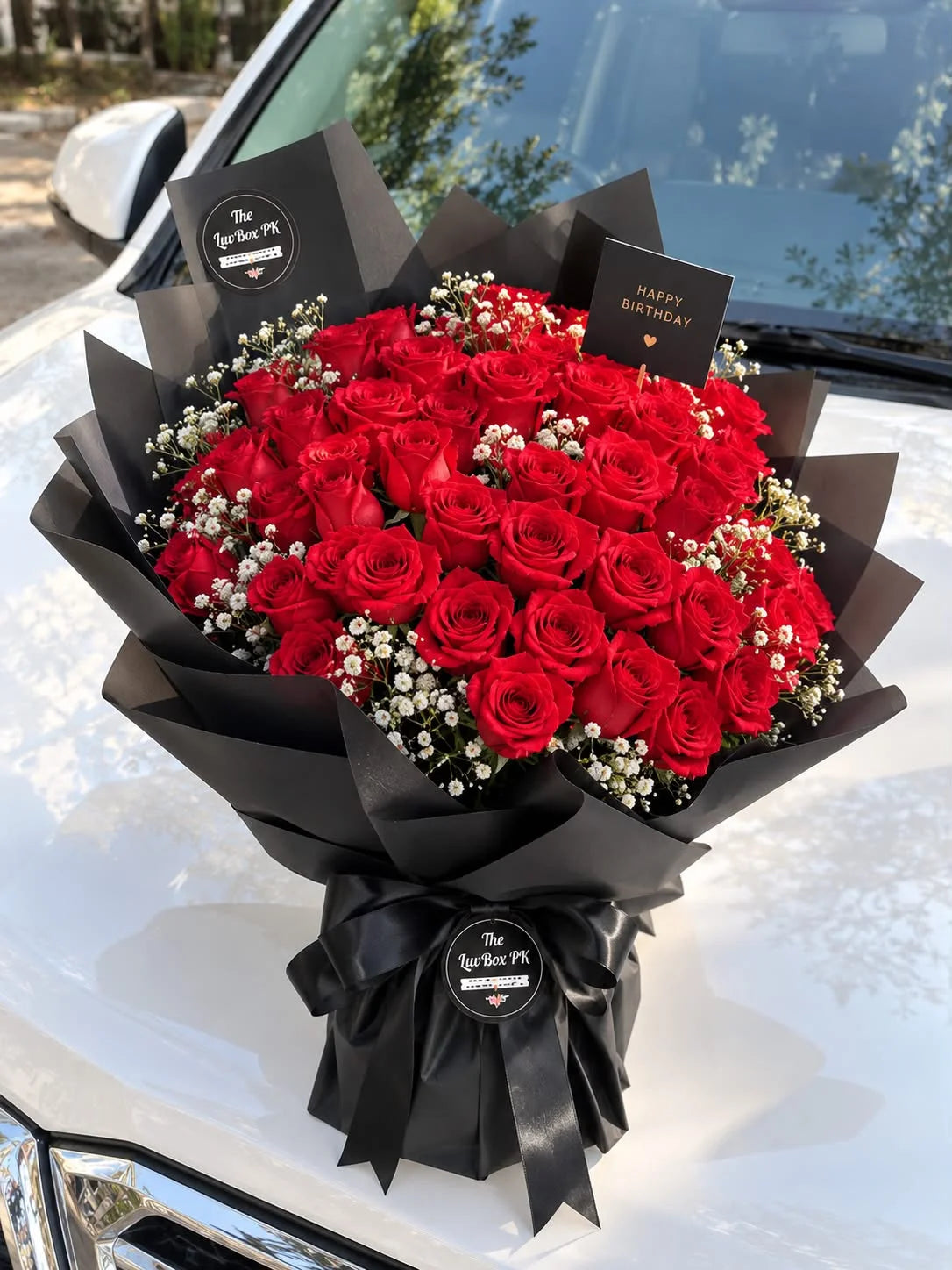 Gorgeous medium-sized fresh red rose bouquet, monthly bestseller for romantic flower delivery in Islamabad and Pakistan
