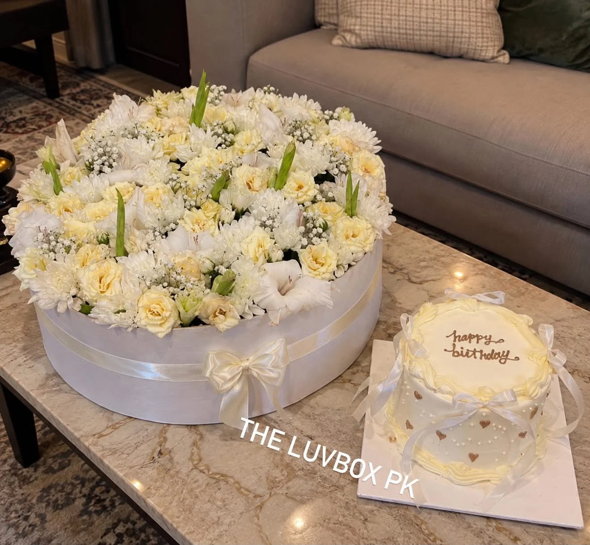 Oversized luxury flower box with elegant red and white themed designer cake for anniversary and birthday gift delivery Pakistan