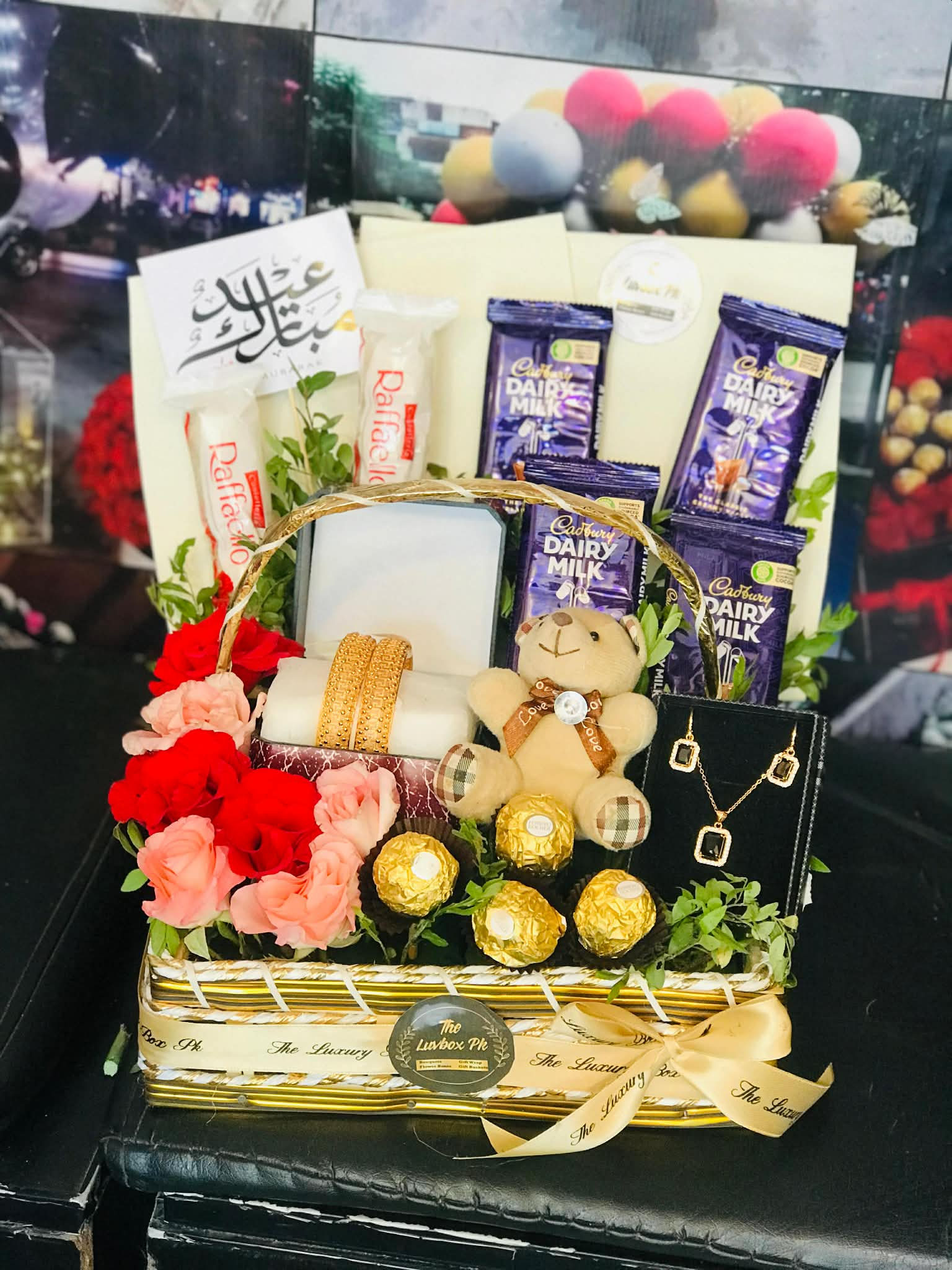 Luxury Eid gift basket with chocolates jewelry and flowers in Islamabad