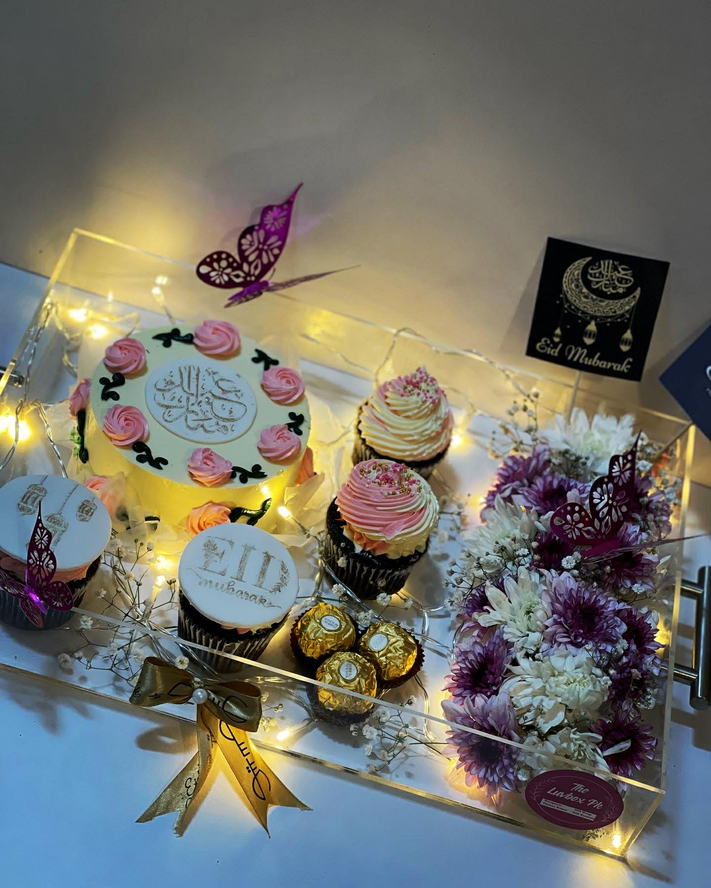 Luxury acrylic Eid tray with Eid themed cake cupcakes and flowers