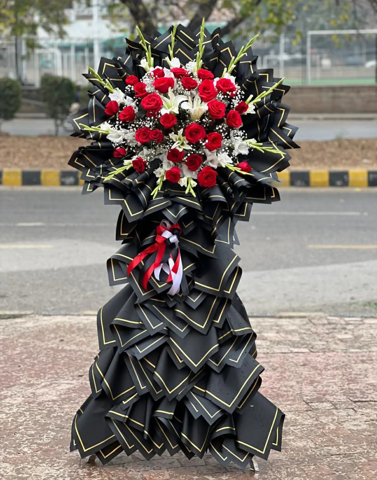 Chinese style long stand bouquet with red roses from gift shop Islamabad
