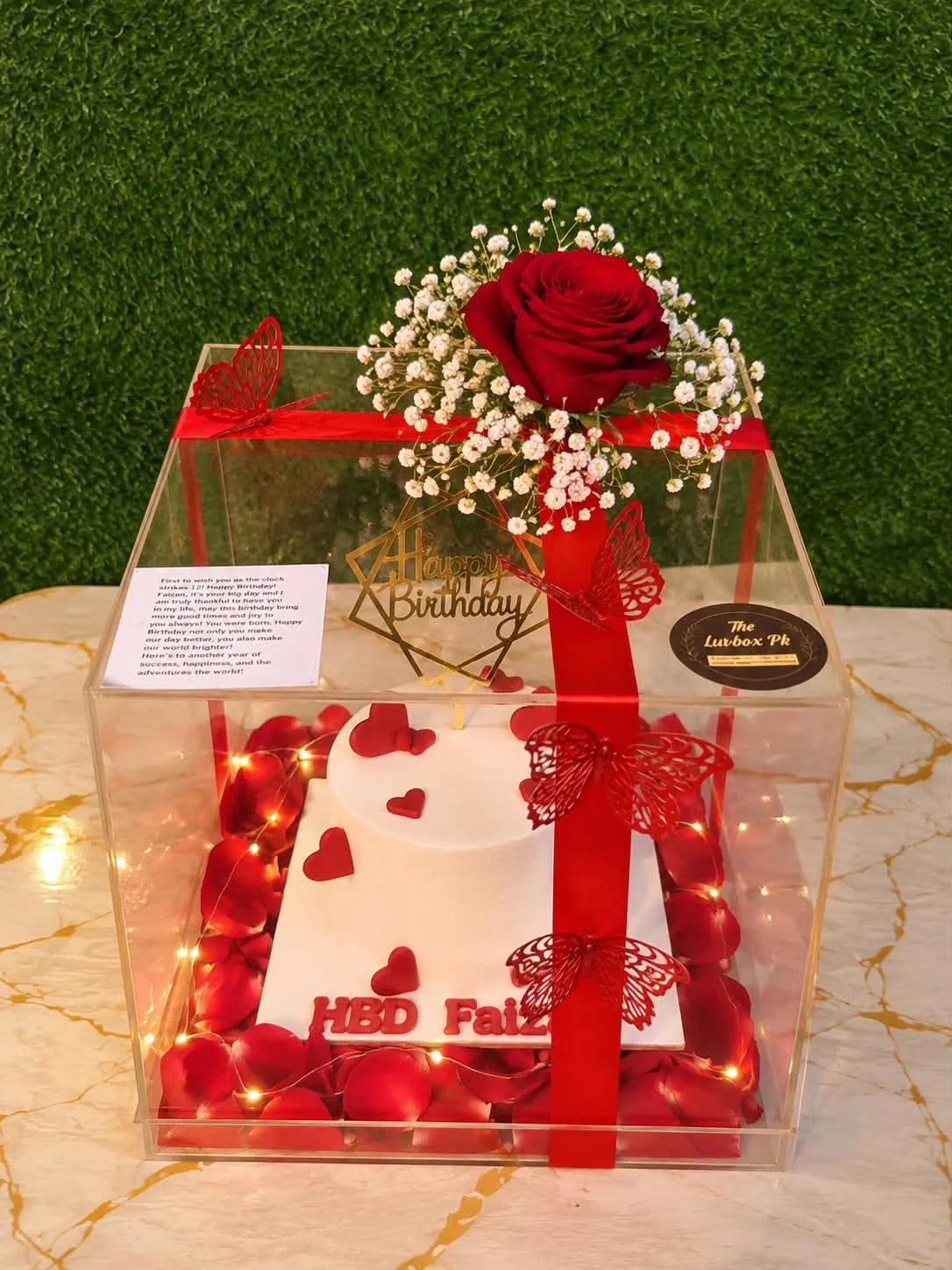 Luxury anniversary acrylic gift box with 2 lbs customized cake, romantic flower petals and glowing LED fairy lights in Pakistan