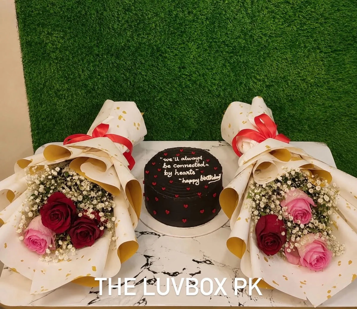 Anniversary combo with 2 lbs custom cake and mini pink and red rose bouquets for delivery in Pakistan