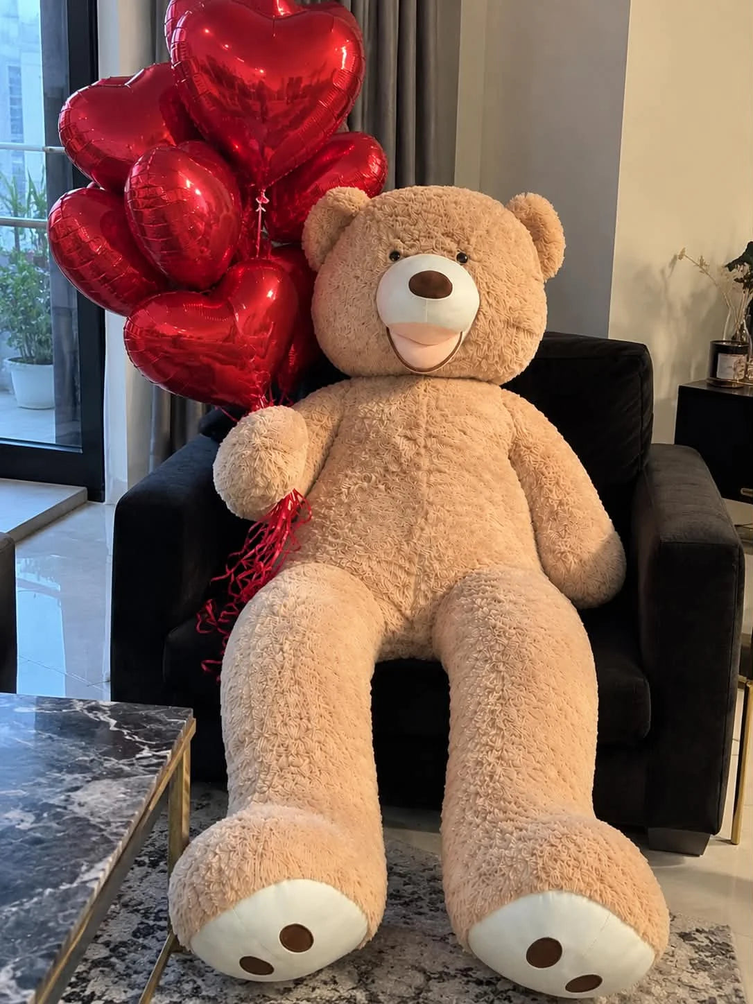 5 feet American Big Paw beige teddy bear with 10 romantic heart-shaped balloons for her birthday gift delivery in Lahore Pakistan
