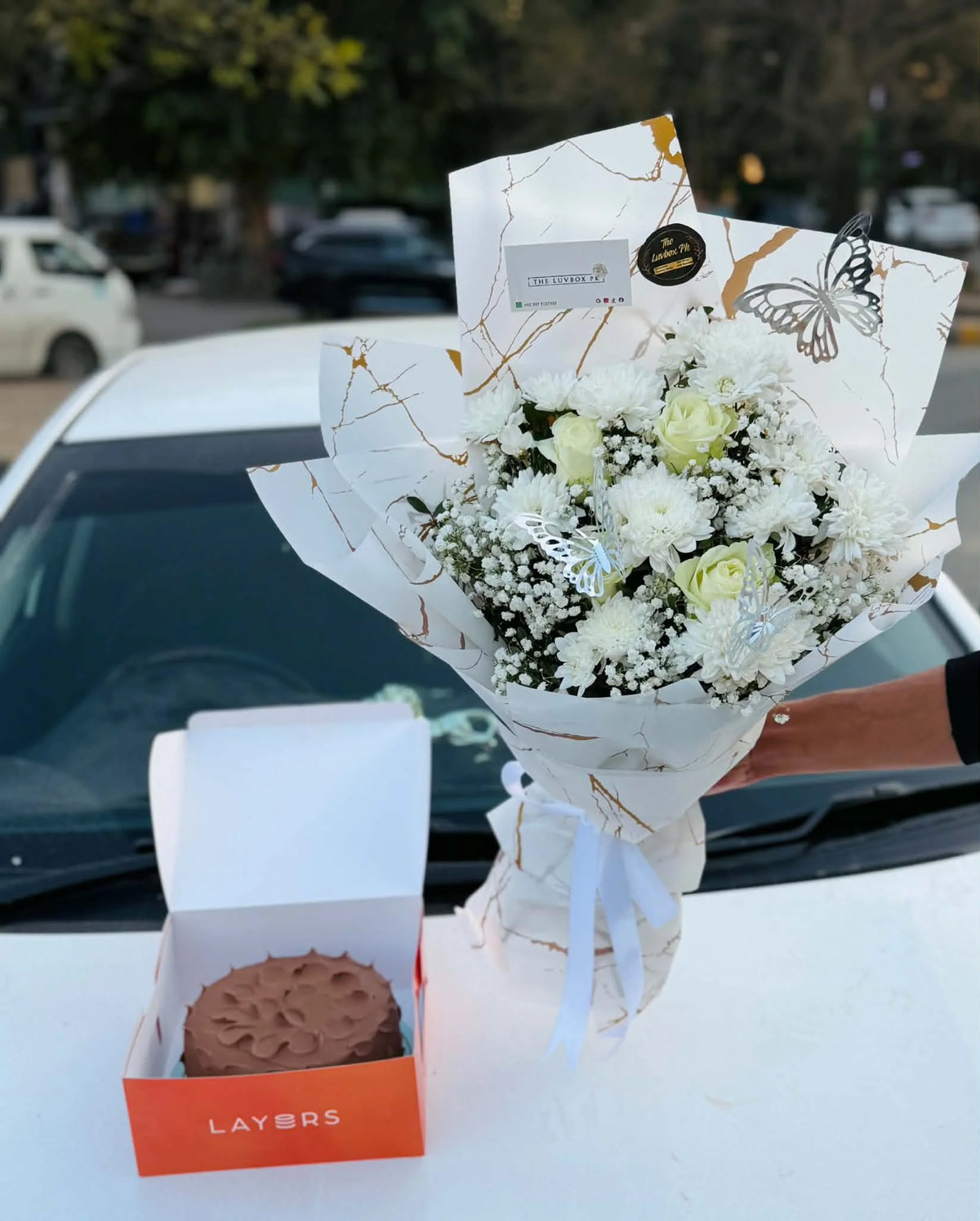 Elegant white flower bouquet with 2.5 lbs Layers Chocolate Fudge Cake for gift delivery Pakistan