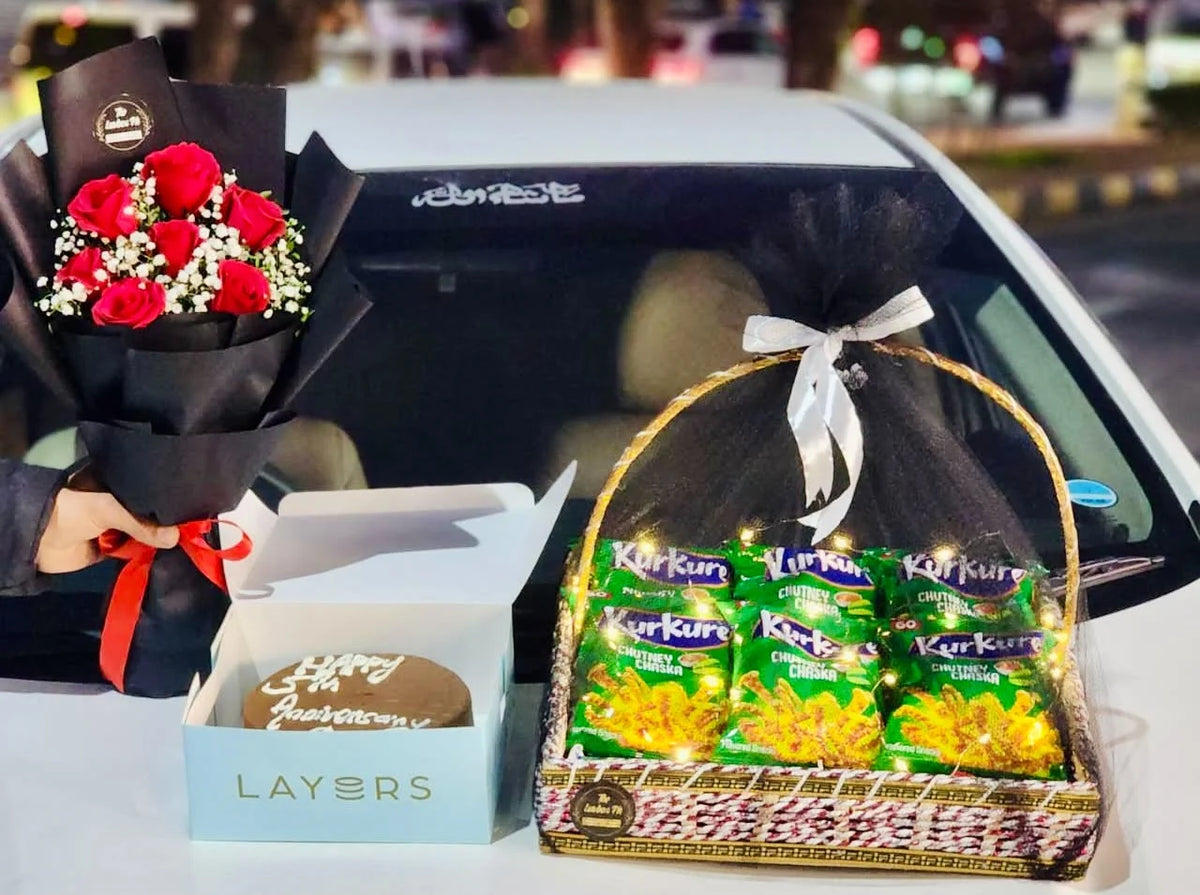 Apology gift combo with mini red rose bouquet 2 lbs Layers Bakery cake snack basket and mixed chocolates Pakistan