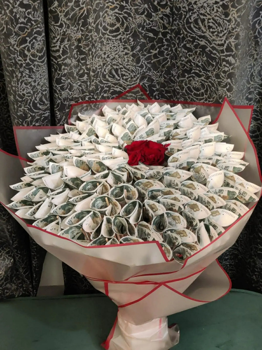 Luxury 50K cash bouquet with red roses and black wrapping.