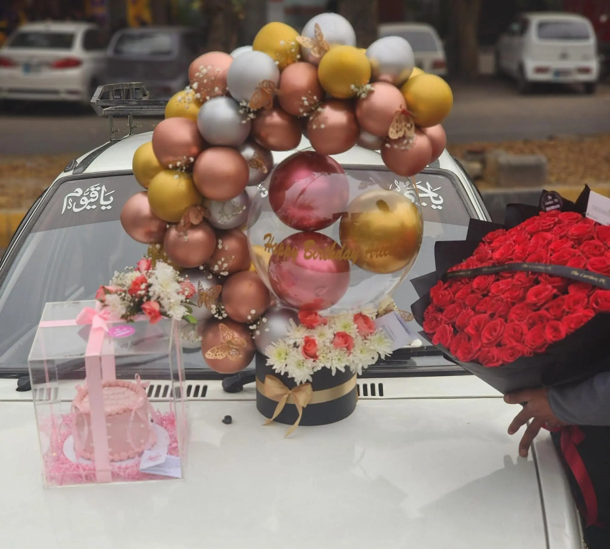 Ultra luxury gift combo with balloon arch bouquet, 100 red roses and cake in acrylic box.