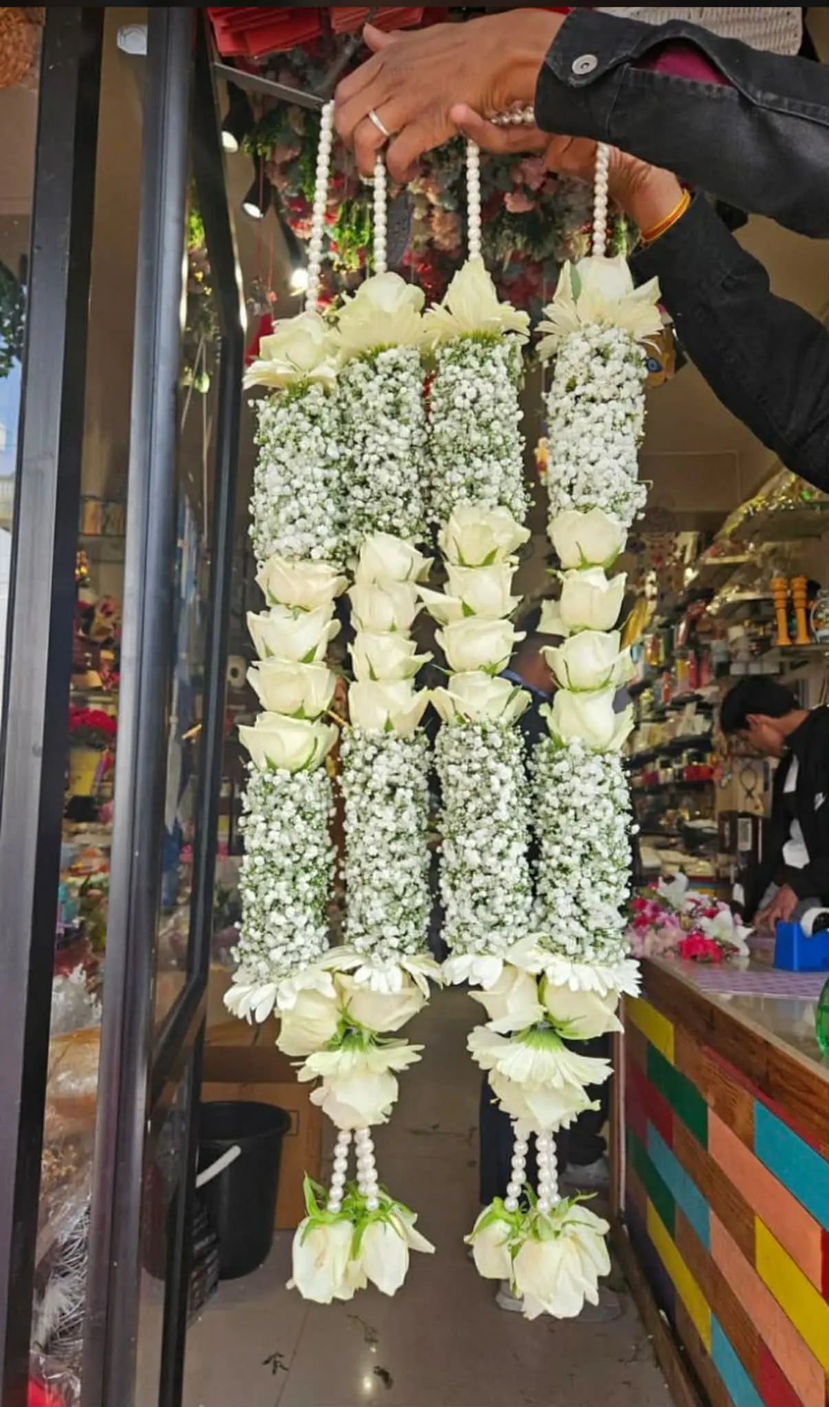 Premium floral garland for groom with roses, chrysanthemums, and baby’s breath.