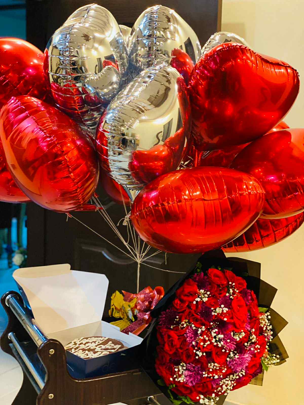 Luxury gift combo with oversized red roses bouquet, foil balloons, and chocolate cake – ideal for weddings, anniversaries, and birthdays in Islamabad.