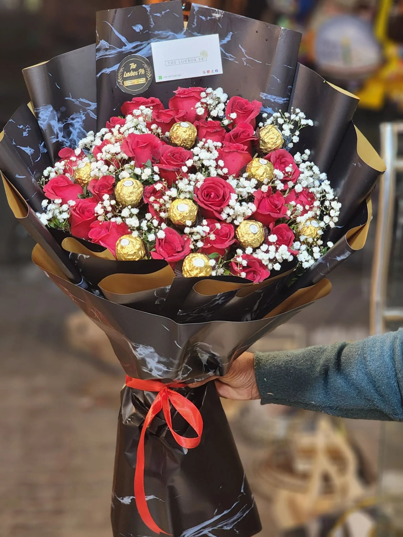 Medium red rose bouquet with Ferrero chocolates luxury budget gift Islamabad