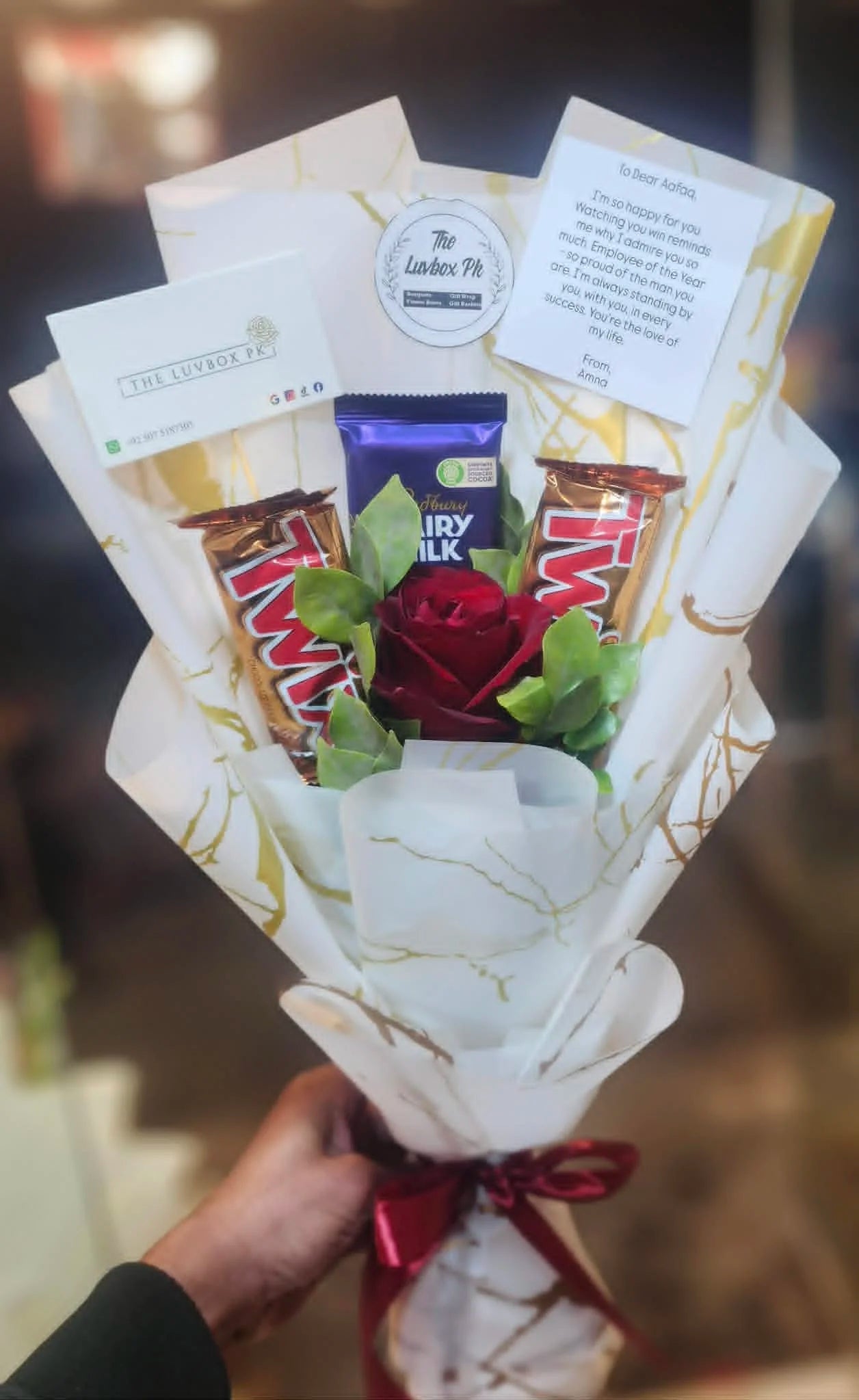 Mini bouquet with one rose and chocolates for affordable gifting in Islamabad.
