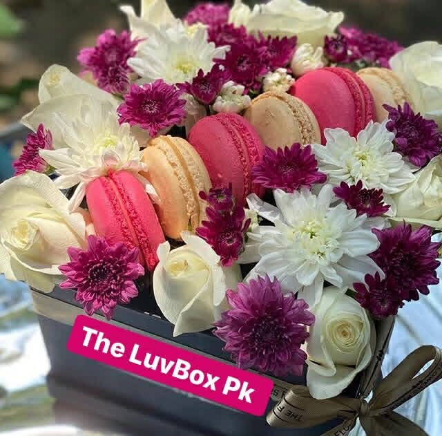 Mother’s Day flower box with chrysanthemums and macarons arranged together for luxury gifting in Islamabad.