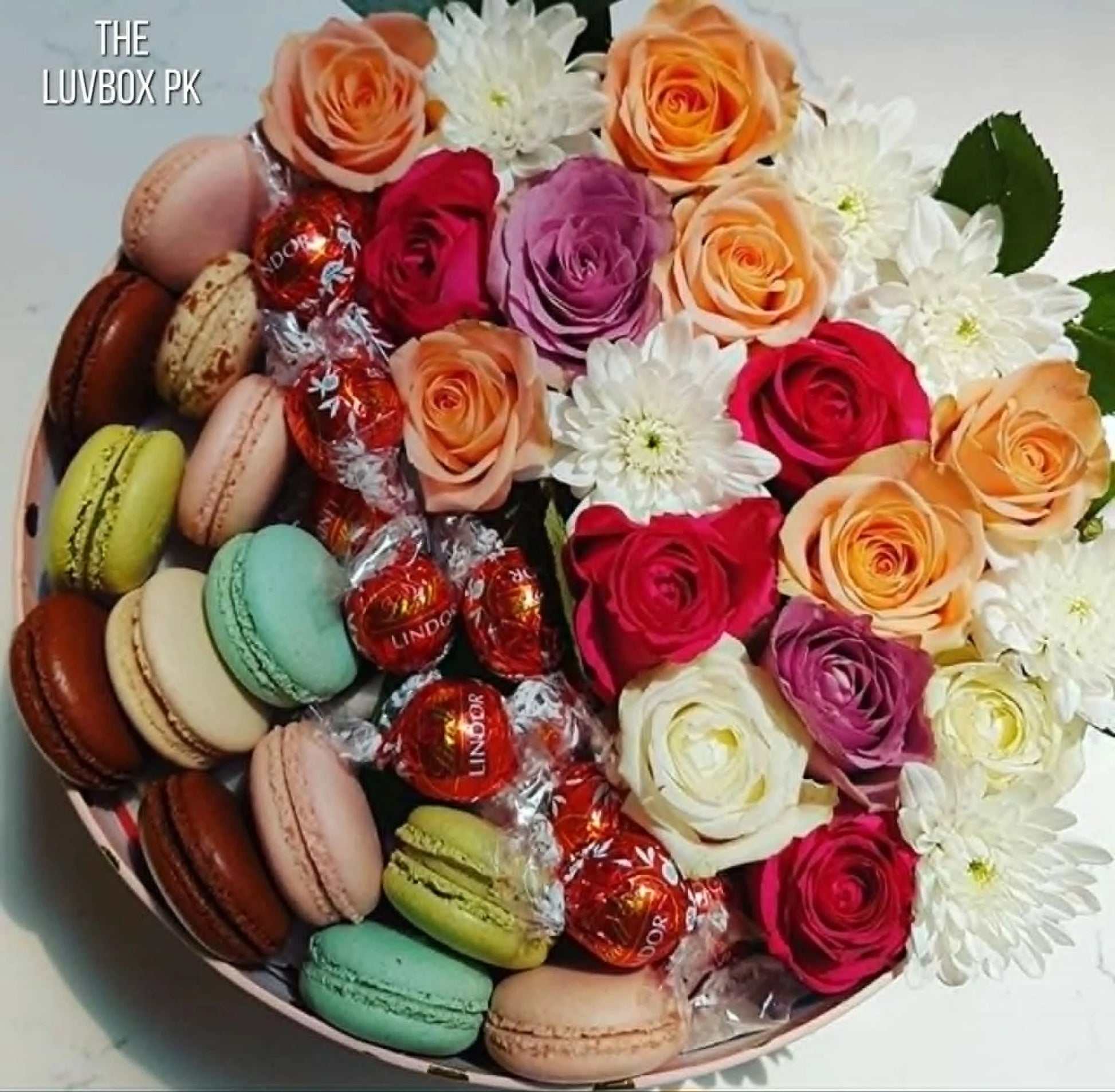 Premium Mother’s Day gift box with roses, Lindor chocolates and macarons in Islamabad.