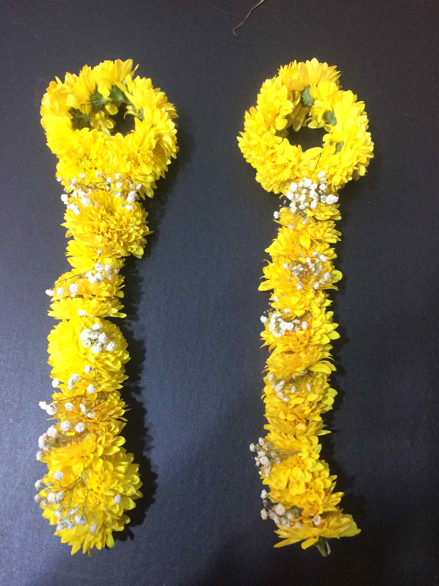 Oversized gainday flower bridal hand bracelets with tails – traditional yellow wedding jewelry in Islamabad, Pakistan.