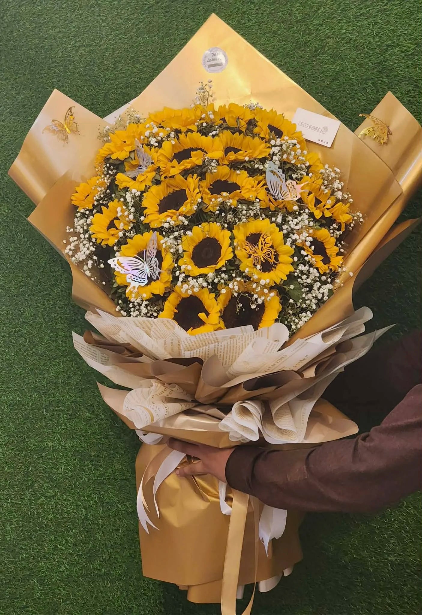 Luxury oversized sunflower bouquet with golden wrapping