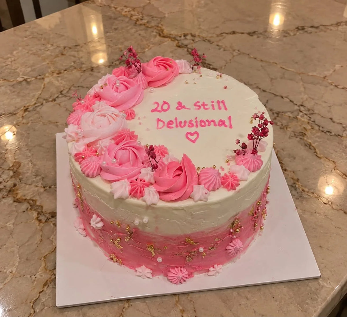 Pretty 2 lbs pink floral birthday cake for her with elegant flower decorations and customized cake delivery in Pakistan