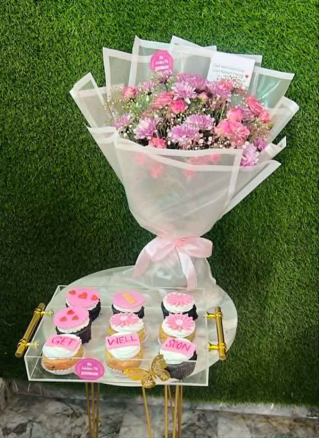 9 pink themed cupcakes with small pink white flower bouquet get well soon combo Pakistan delivery