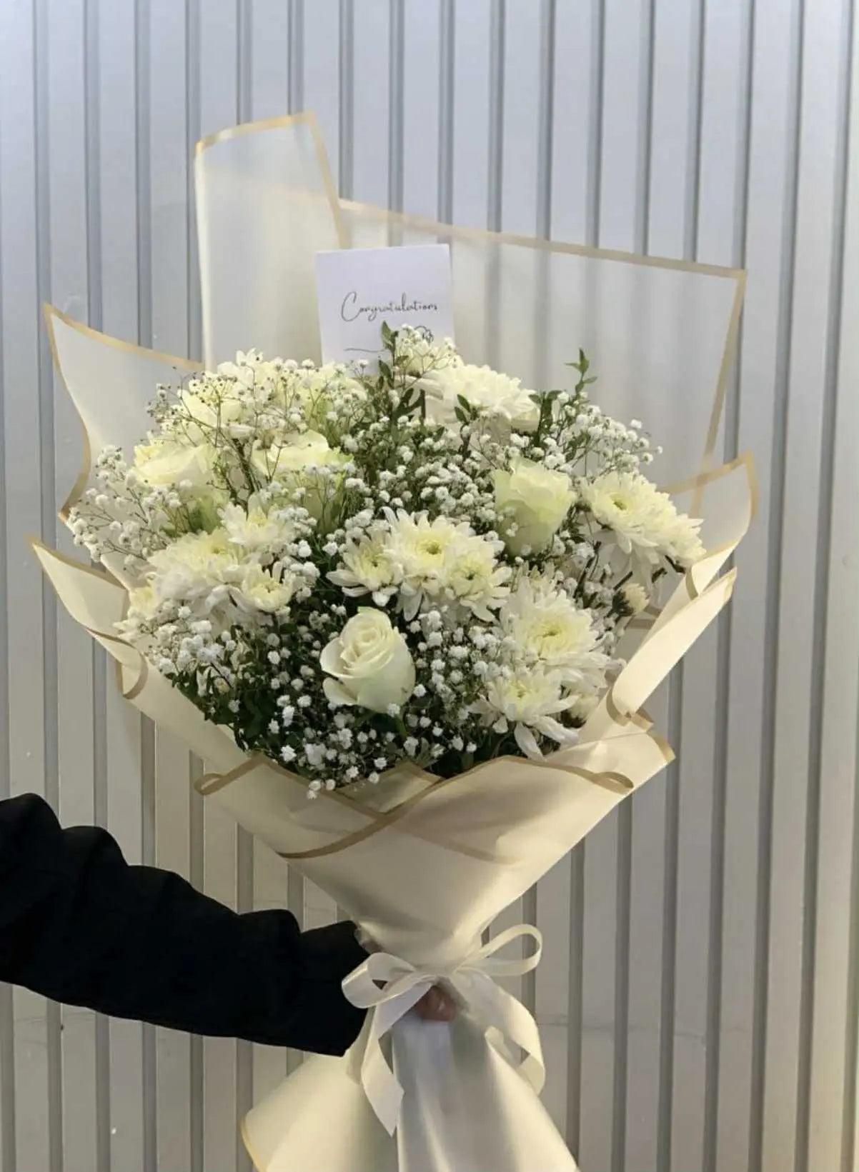 White themed fresh flower bouquet elegantly wrapped