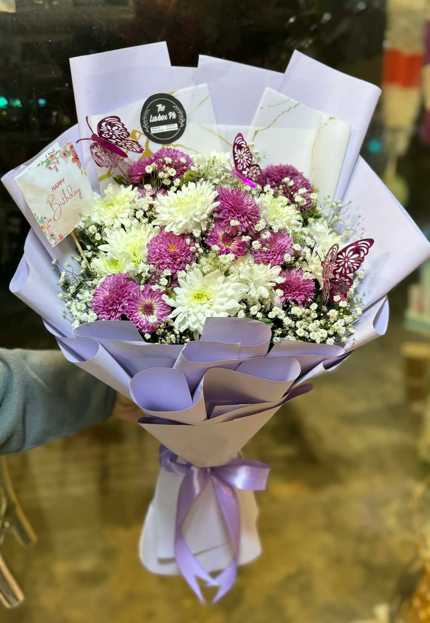Purple themed chrysanthemum flower bouquet for special occasions