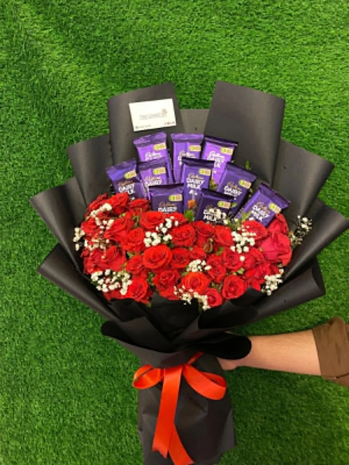 Gorgeous red rose bouquet with Dairy Milk chocolates, beautifully arranged and wrapped as a romantic gift for birthdays, anniversaries and special occasions in Islamabad.