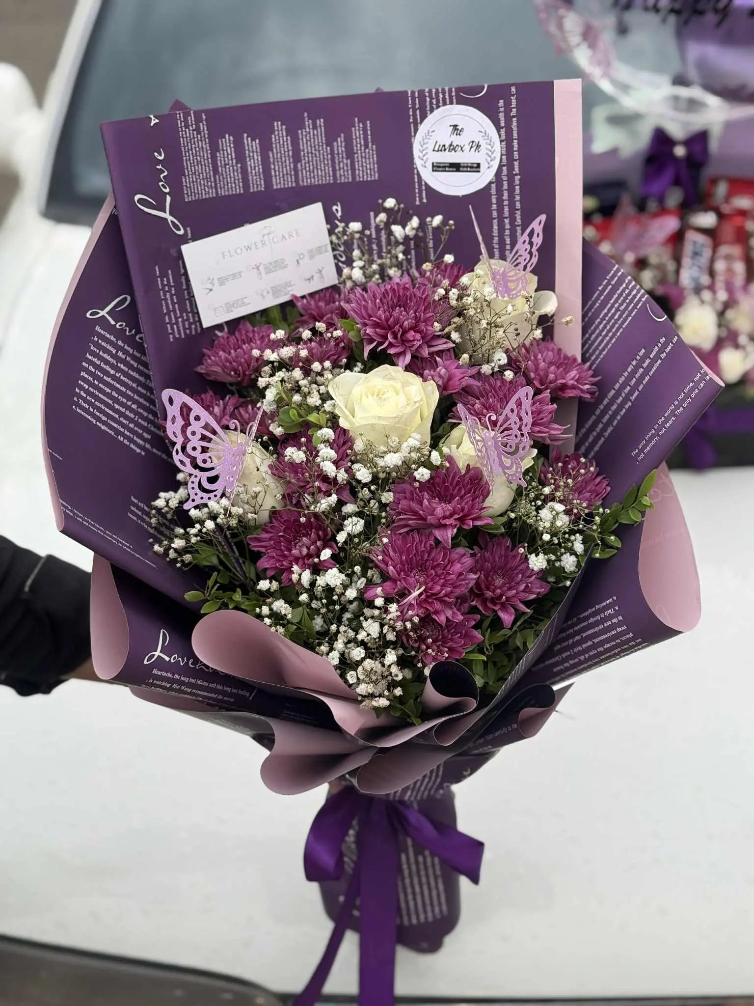 Luxurious purple flower bouquet wrapped in elegant packaging