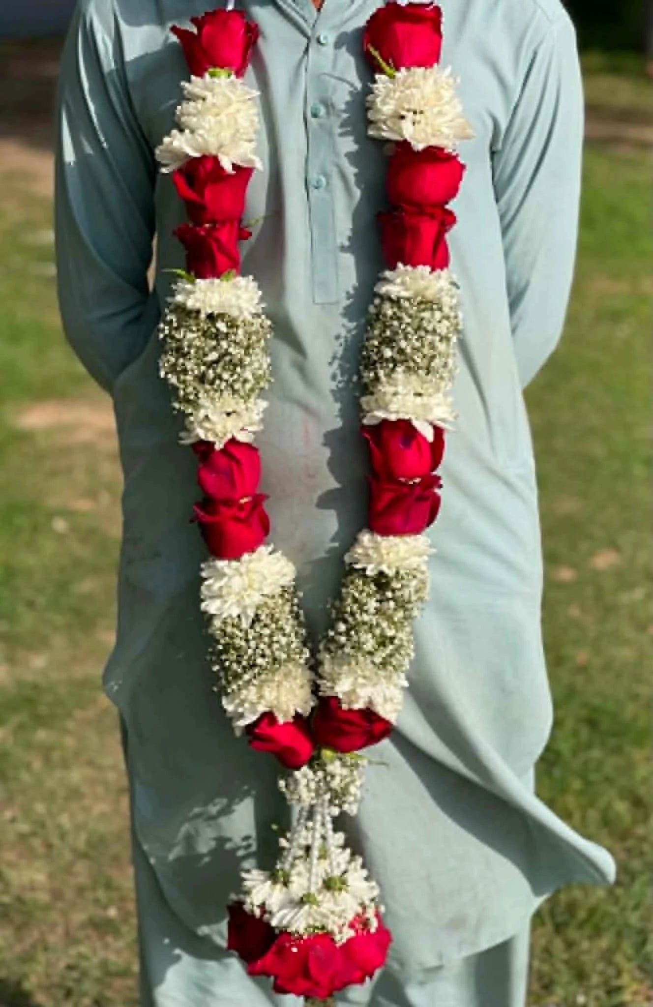 Heavy premium floral garland made with red roses, Baby’s Breath, and white chrysanthemums for weddings, bridal ceremonies, and events in Pakistan.