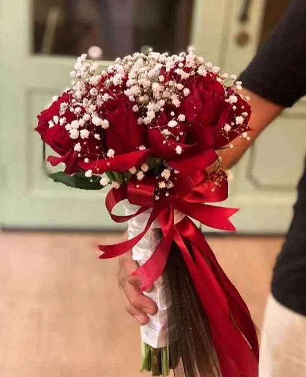 Luxury bridal bouquet with premium long-stem red roses, perfect for weddings, nikah ceremonies, engagements, and bridal photoshoots in Pakistan.