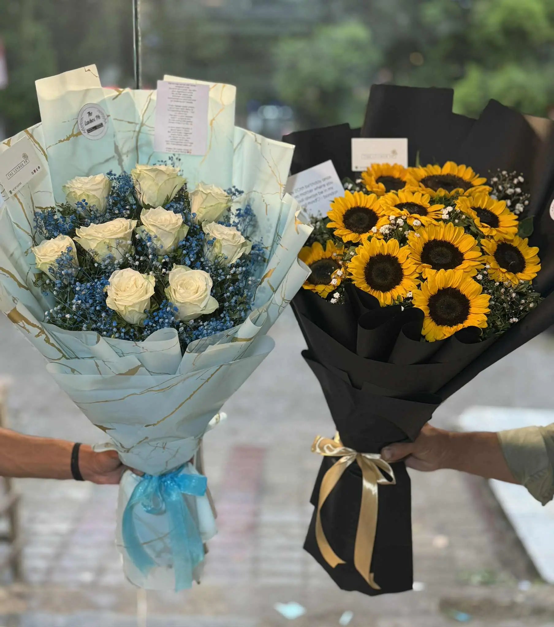 Duo of sunflower bouquet and white rose with blue baby’s breath bouquet in Islamabad.
