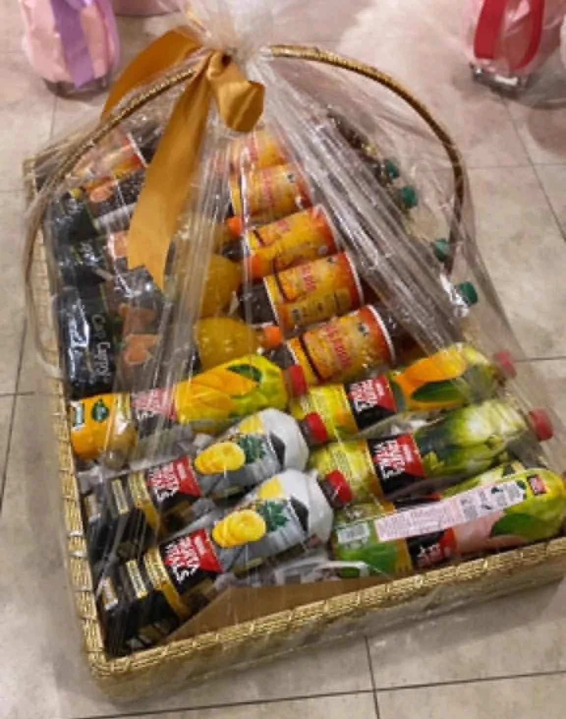Luxury get well soon gift basket with over 20 large assorted juice bottles on a premium tray with decorative net for healthy gift delivery in Pakistan.