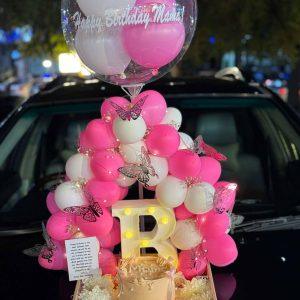 Luxury wooden tray with balloon arch, custom cake, LED letter, and flowers – The LuvBox PK gift shop in Islamabad