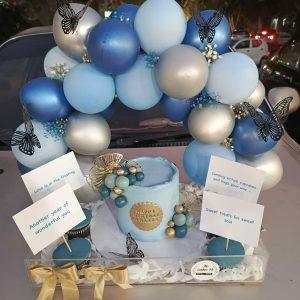 Luxe acrylic tray with balloon arch, custom cake, and floral design for him by The LuvBox PK