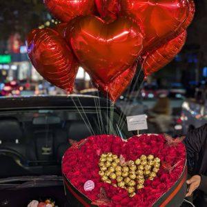 XXL heart-shaped red rose box with Ferrero Rocher chocolates, custom cake and helium balloons from The LuvBox PK
