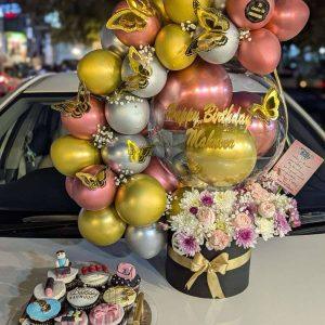 Luxury birthday balloon arch box with 9 custom cupcakes in an acrylic tray by The LuvBox PK