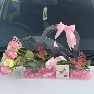 Rosé Luxe premium rose bouquet in acrylic handbag – luxury flower delivery in Islamabad