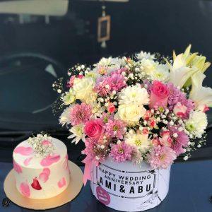 Custom floral gift box with cake – roses, chrysanthemums, butterflies, and a 2 Lbs cake for birthday in Islamabad