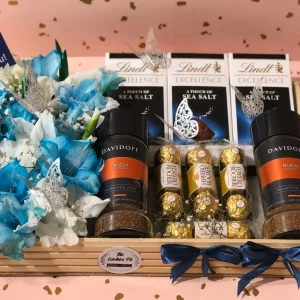 Luxury wooden tray with Lindt chocolates, coffee jars and flowers by The LuvBox PK – gift shop in Islamabad